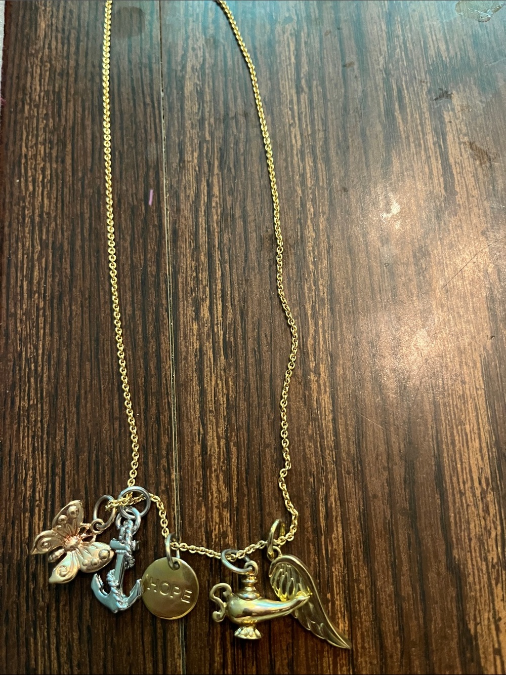 Gold-Tone Charm Necklace with Lamp, Anchor & Hope Disc gently worn